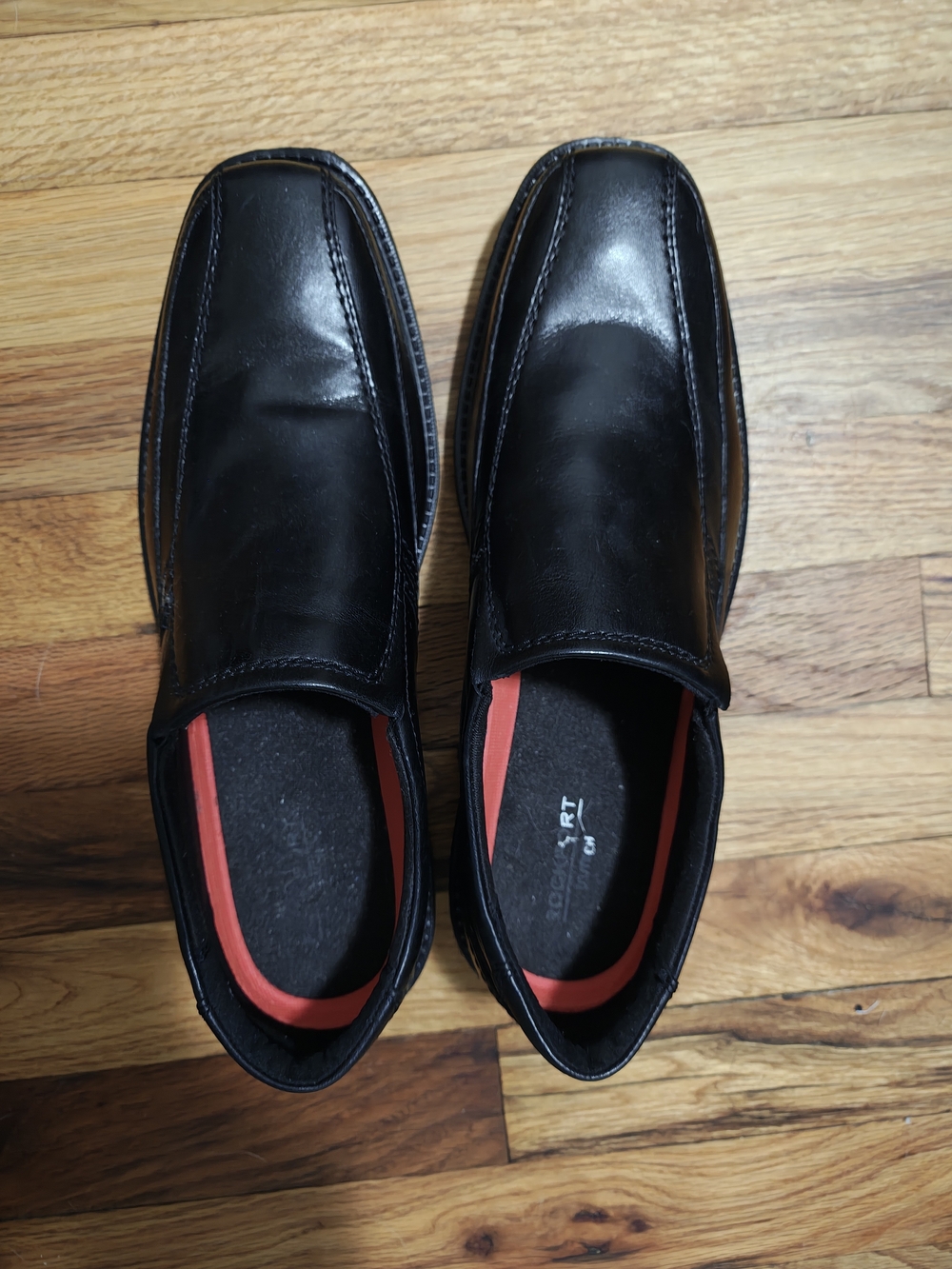 Rockport Men's Black Slip-On Leather Loafers with Red Interior Accent